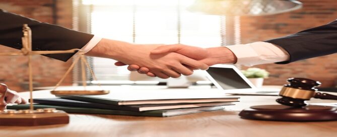 Lawyer And His Client Handshake. Agreement With Attorney In Offi